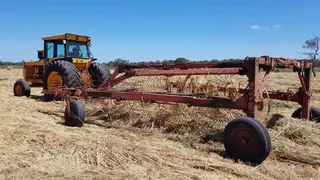 Hay raking equipment in a cut paddock